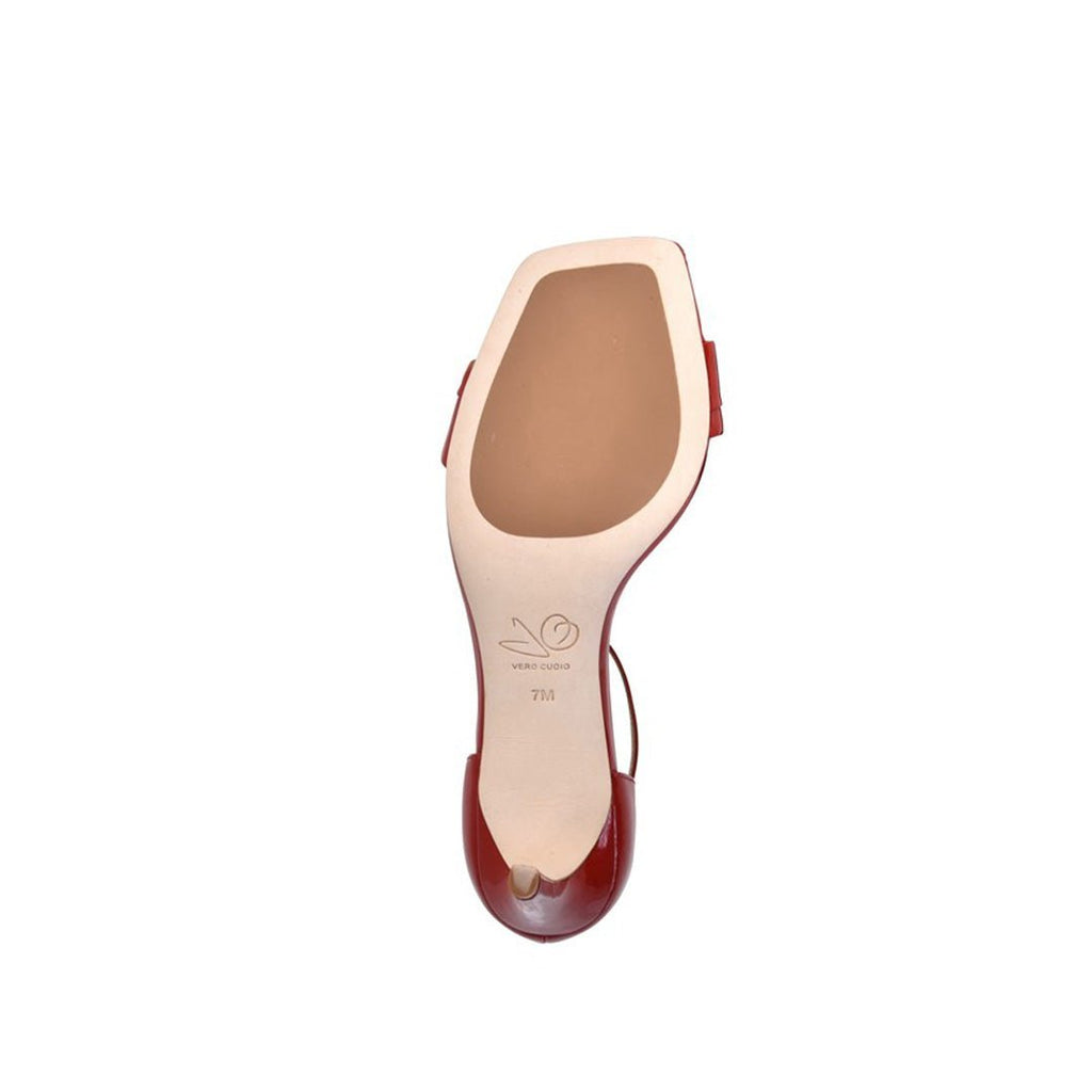 Red high-heeled shoe sole on a white background