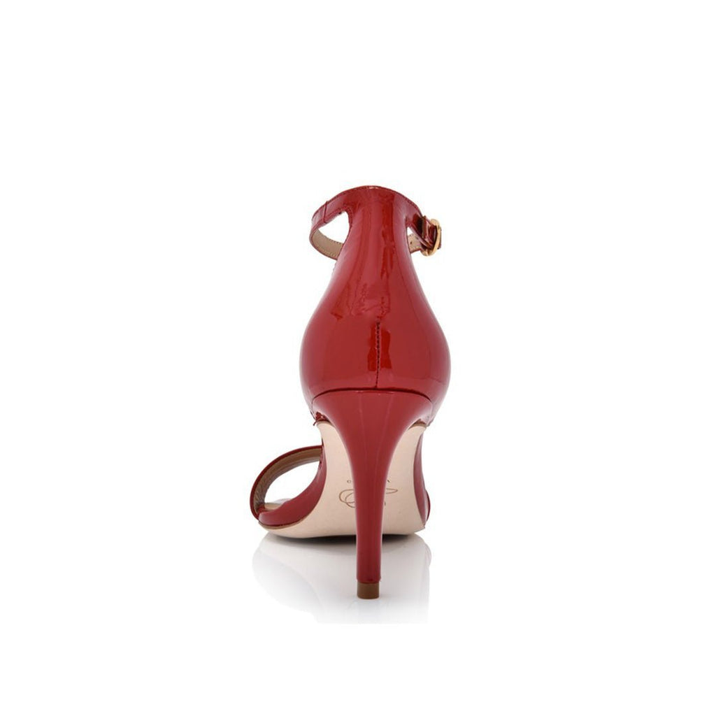 Red high-heeled shoe on a white background