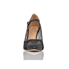Black high-heeled shoe with a clear sole on a white background